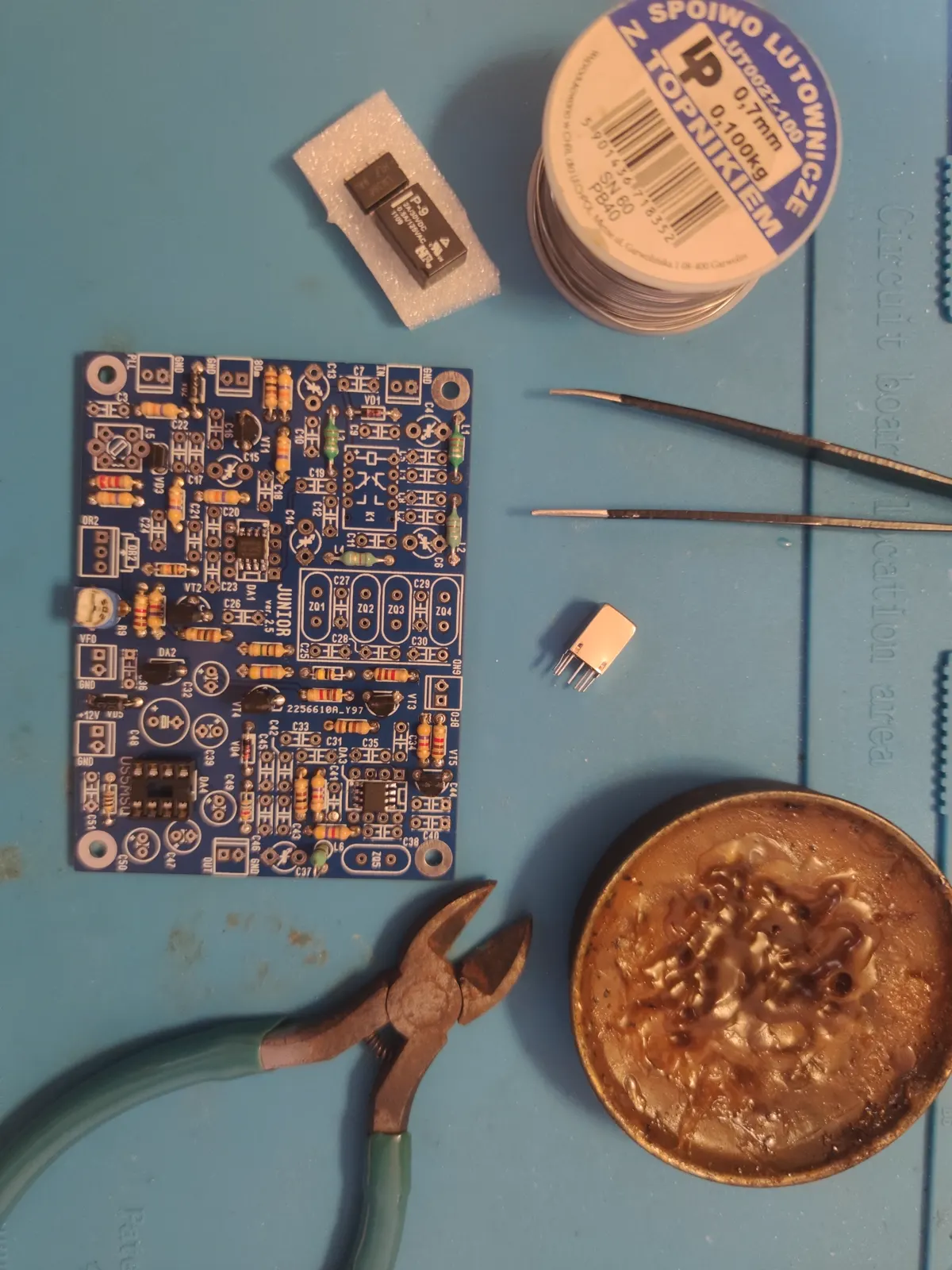 The board with resistors, the P-9 relay and the first capacitors fitted